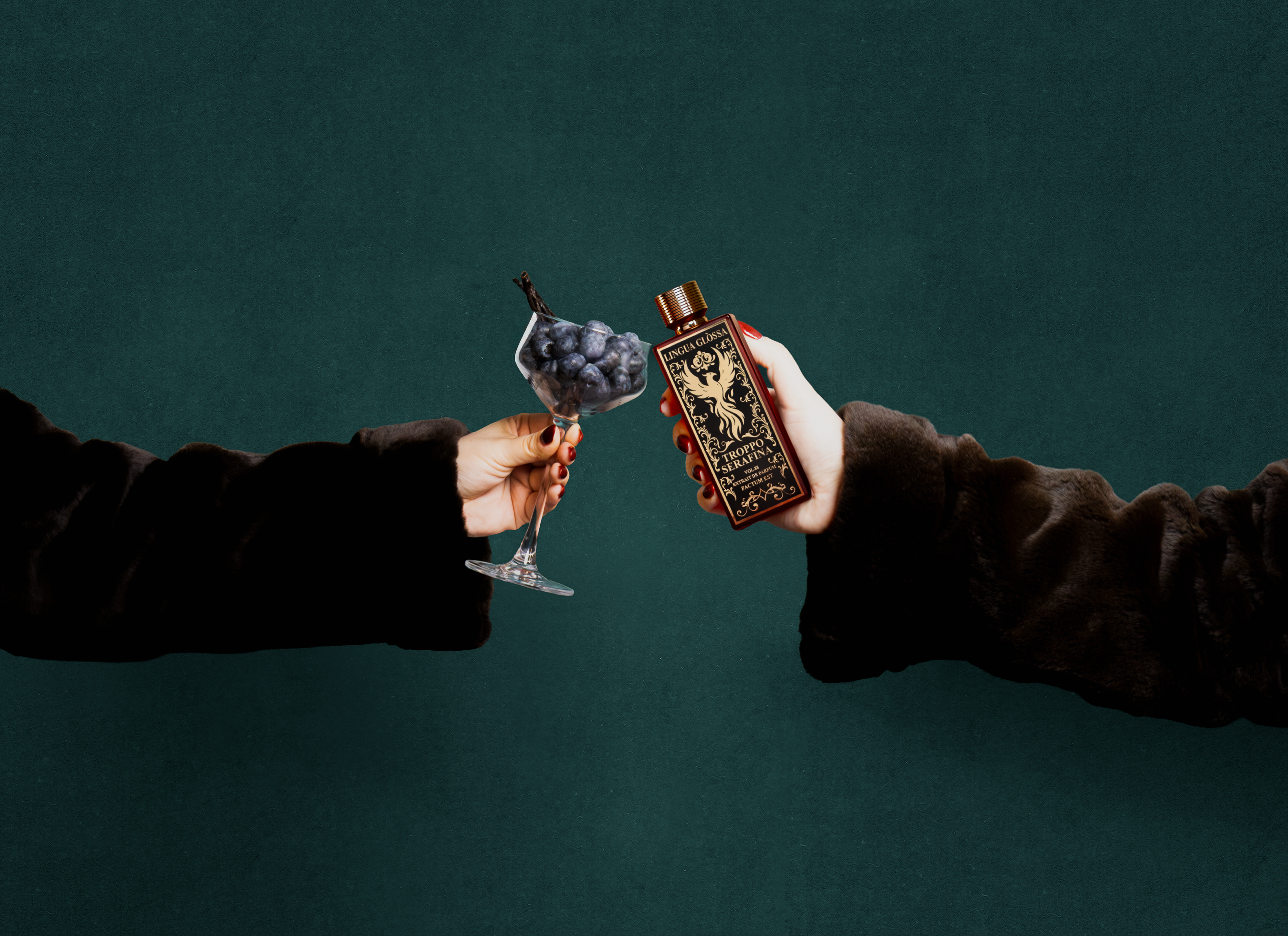 Two hands clinking a bottle of perfume and a cocktail glass against a dark green background